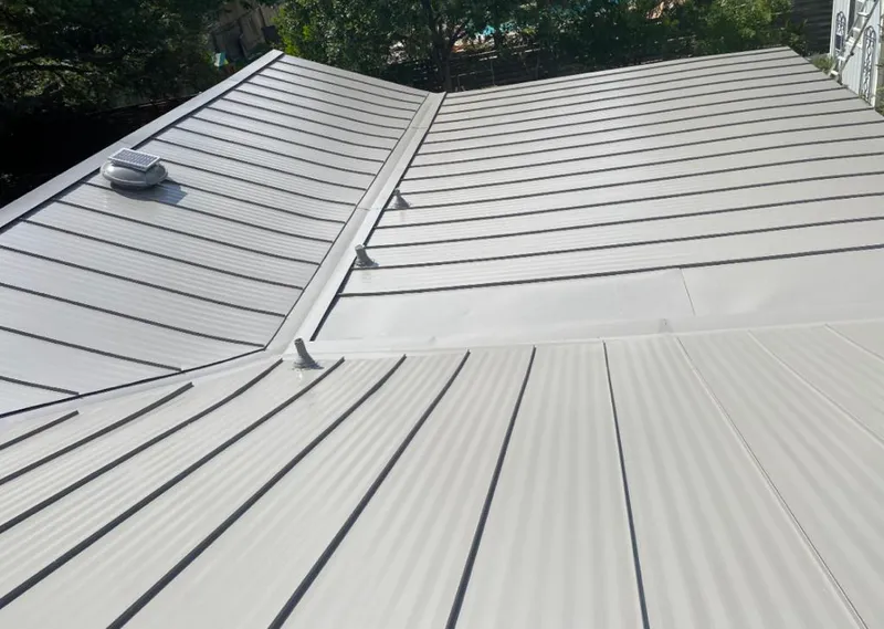 Solar attic fan installed on a metal roof for Roof Ventilation in Eatonton